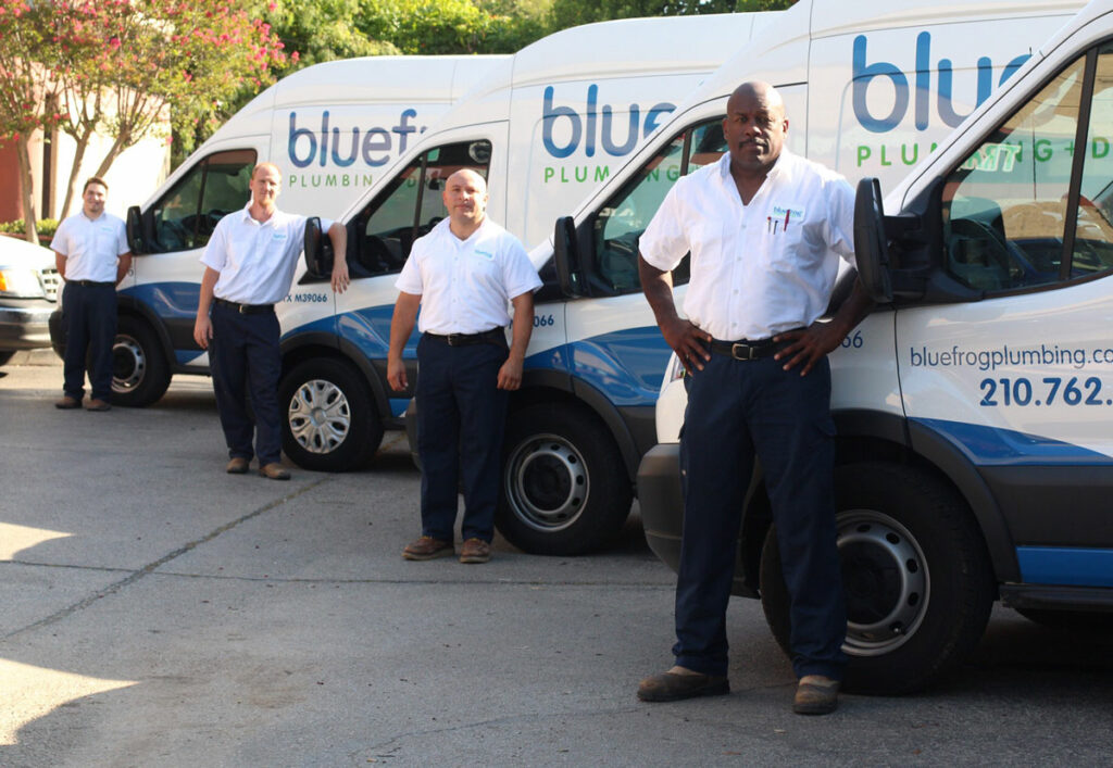 bluefrog Plumbing + Drain plumbing franchise owners in front of trucks